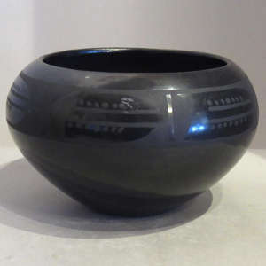 Geometric design on a black on black jar