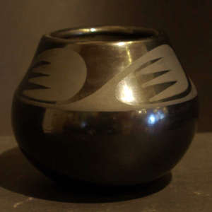 Bird wing design on a black on black jar
