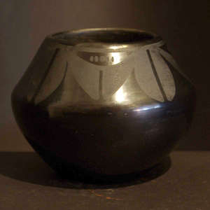 Geometric design on a black on black jar