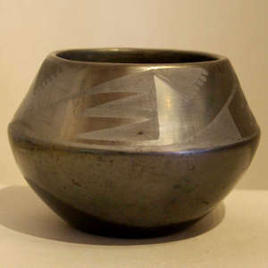 Geometric design on a black on black jar