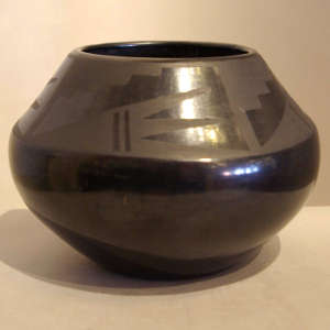 Geometric designs on a black on black jar