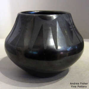 Geometric design on a black on black jar