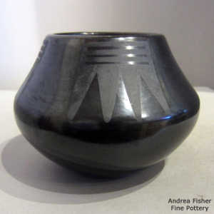 Geometric design on a black on black jar