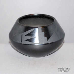 Geometric design on a black on black jar