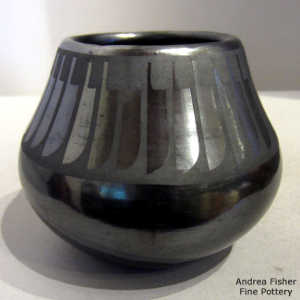 Feather design on a black on black jar