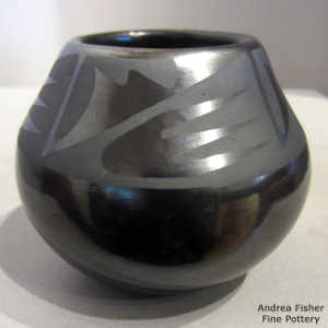 Geometric design on a black on black jar