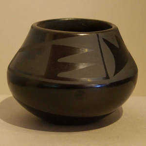 Geometric designs on a black on black jar