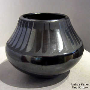 Feather design on a black on black jar