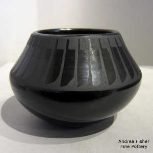 Feather design on a black on black jar