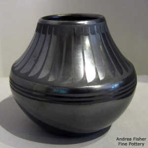 Feather design on a black on black jar