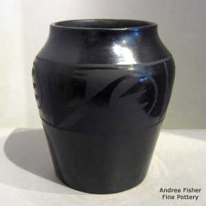 Four panel bat wing and geometric design on a black on black jar