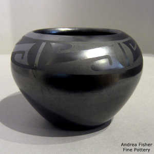 Geometric design on a black on gunmetal black jar