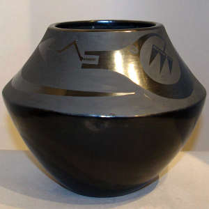 Avanyu design on a black on black jar