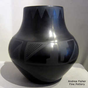 A kiva step and geometric design on a black on black jar