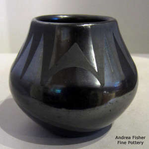 A geometric design on a black on black jar