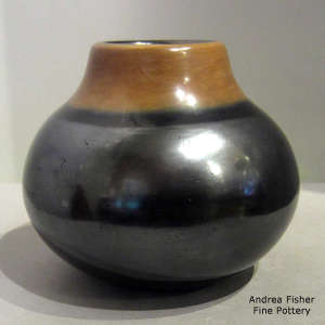 Gunmetal black jar with a sienna rim