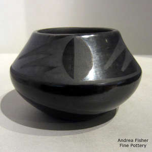 Geometric design on a black on black jar