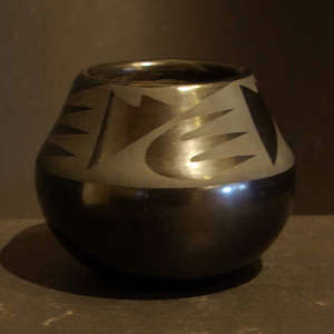 Bear opaws and geometric designs on a black on black jar