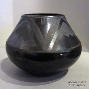 Black on black jar with a geometric design