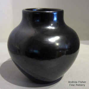A plain, polished black jar