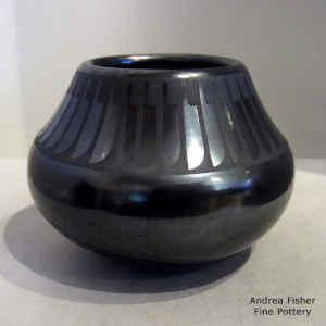 Band of feathers design on a black on black jar