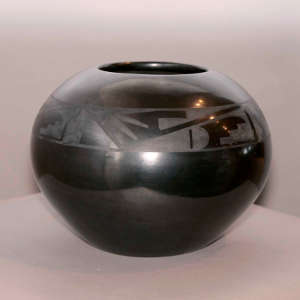 Geometric designs on a black on black jar