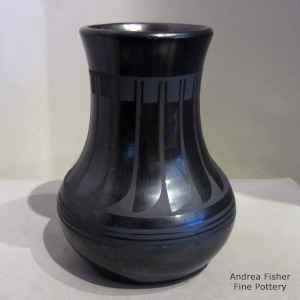 A band of feathers on a black on black vase