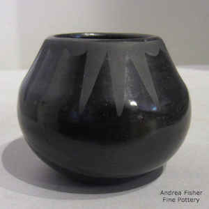 A geometric design on a black on black jar