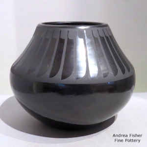 A band of feathers on a black on black jar