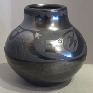 Avanyu and cloud design on a black on black jar