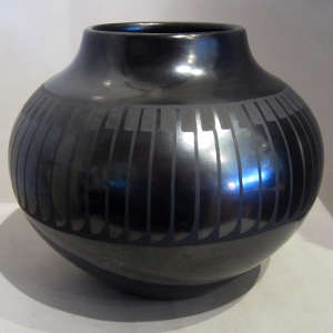 Feather design on a black on black jar