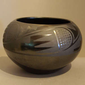 Bird wing design on a black on black jar