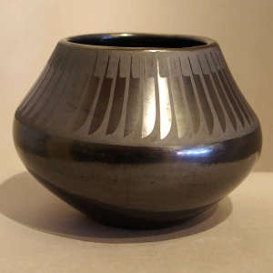 Feather design on a black on black jar