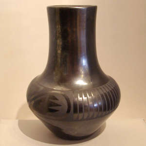 Feather and geometric design on a tall necked black on black jar