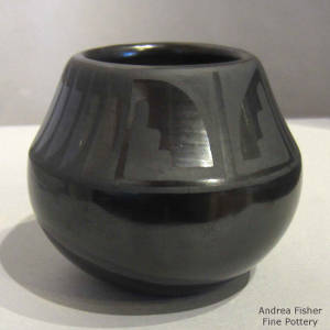 Kiva step, feather and geometric design on a black on black jar