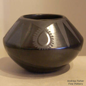 Geometric designs on a black on black jar