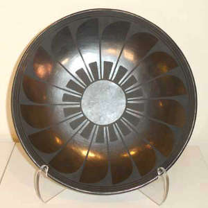 Feather design on a black on black plate