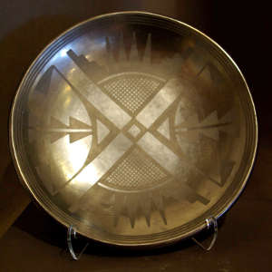 Geometric designs on a black on black plate