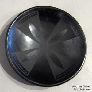 Geometric design on a black on black plate