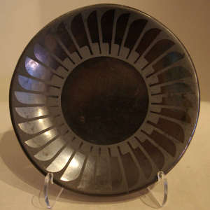 Feather design on a black on black plate