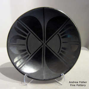 Geometric design on a black on gunmetal black plate