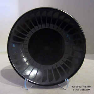 Band of featrhers design on a black on black plate