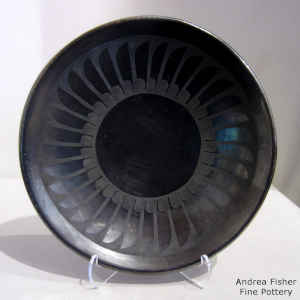 Ring of feathers design on a black on gunmetal black plate