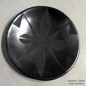 Geometric design on a black on black plate
