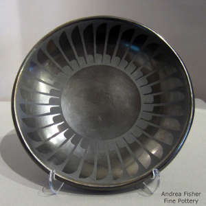 Feather design on a black on black plate