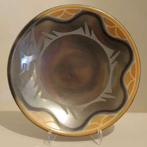 Avanyu design and sienna rim with cloud design on a black gunmetal plate