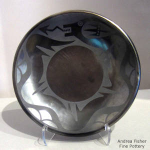 Avanyu design on a gunmetal black on black plate