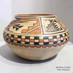 A checkerboard and geometric design on a polychrome jar
