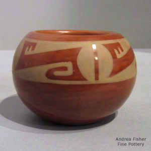 4-panel cream geometric design on a red jar