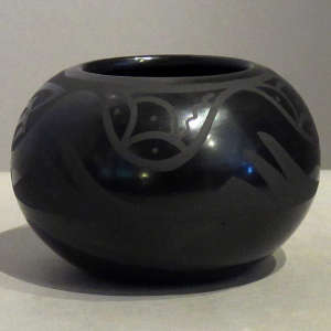 Avanyu design on a black on black jar